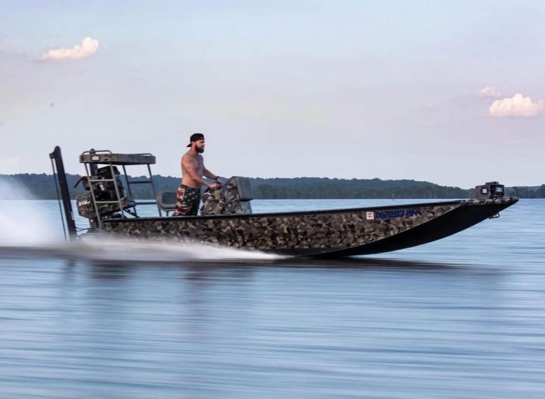Camo Uncle J boat running fast across open water