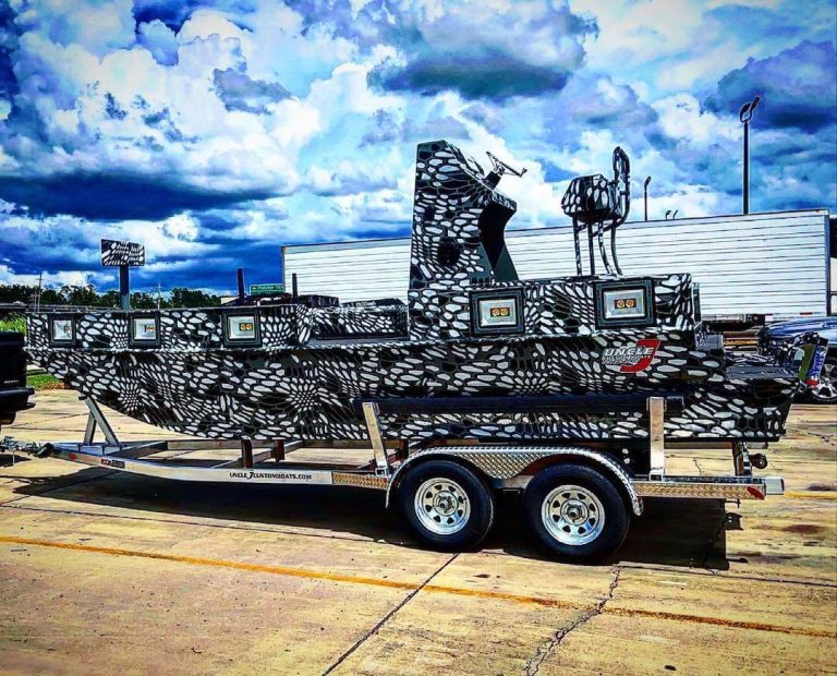 Nock-Turnal Bowfishing boat in black and white camo on a double-axle trailer