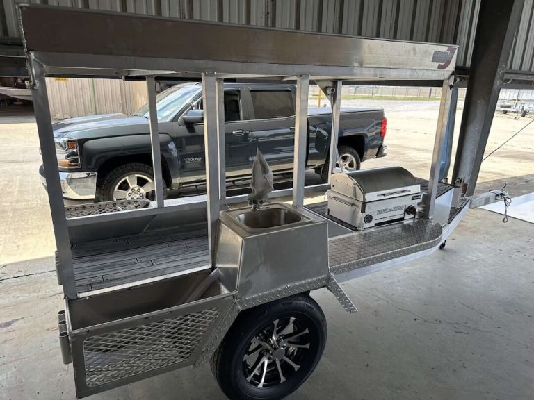 Aluminum cooking trailer with a grill and a sink
