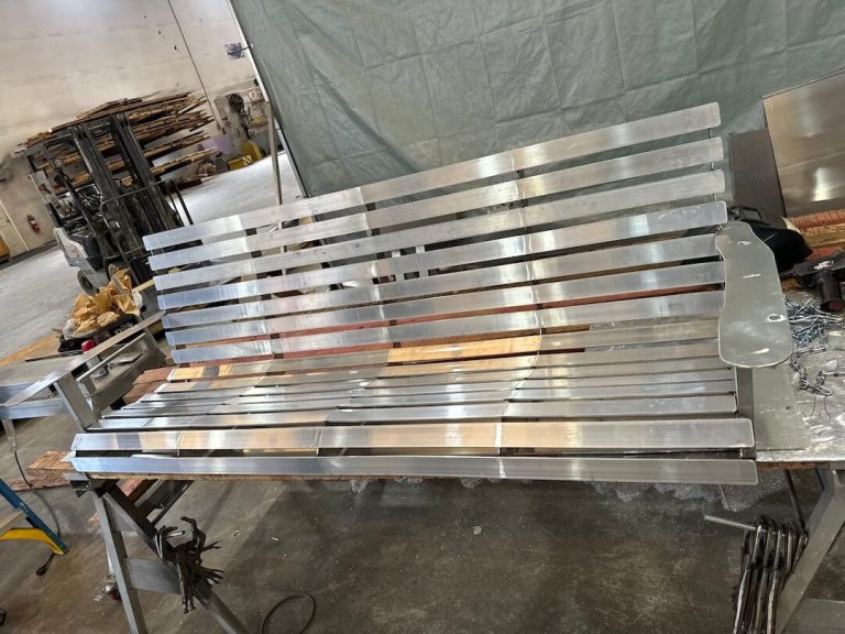 Aluminum bench swing being built in the shop