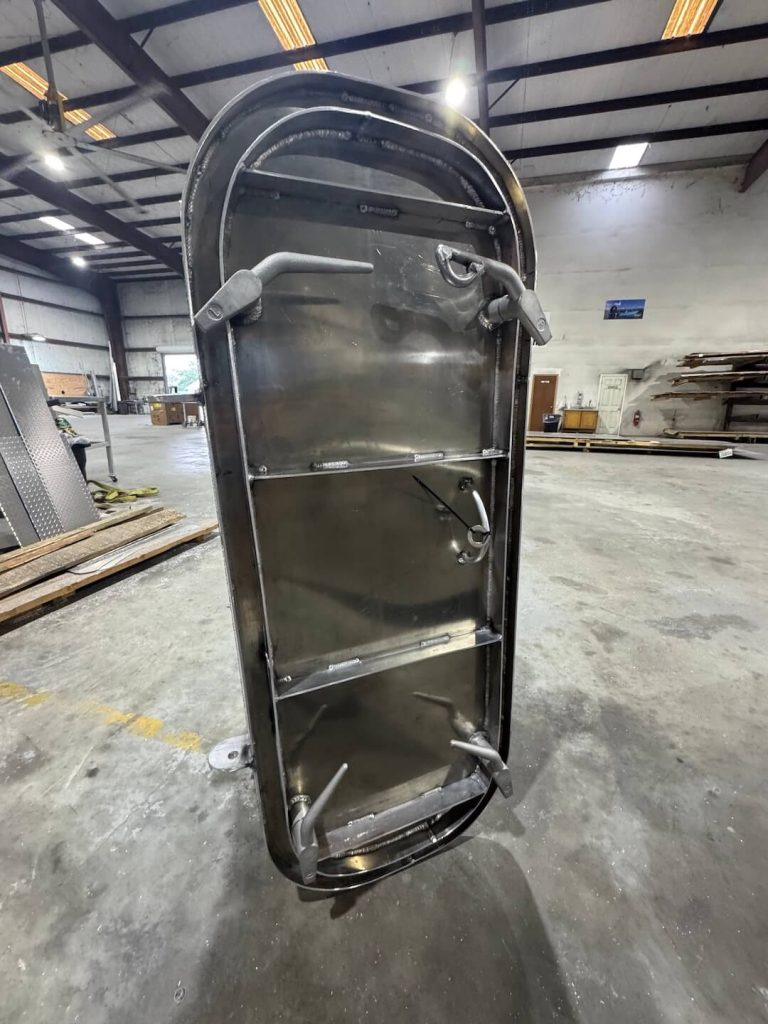 Inside face of the rounded aluminum hatch door