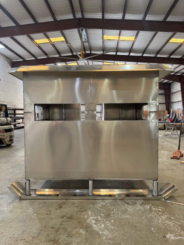 Aluminum enclosure on skids with two long window openings